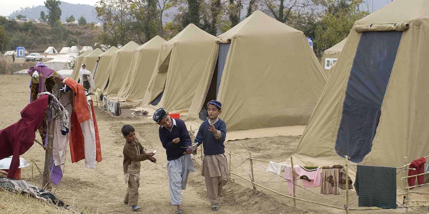 young boys playing in a refugee camp