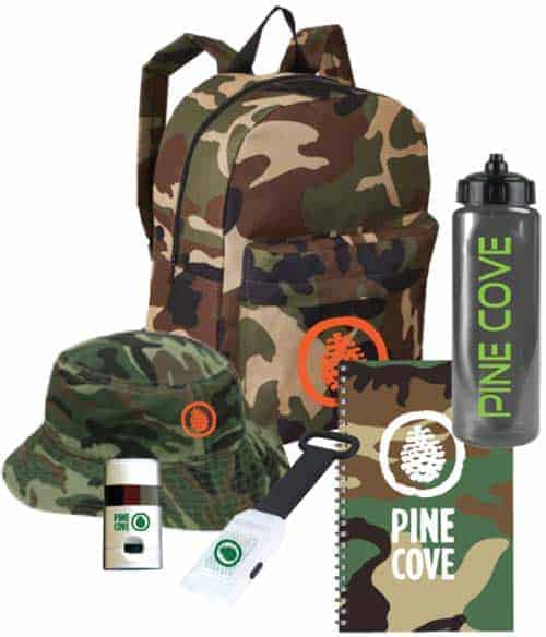 Image of a camper pack for Pine Cove's commando theme. The camper pack includes a camo backpack, camo bucket hat, sports water bottle, camo face paint, flashlight, and camo notebook, all branded for Pine Cove Camps
