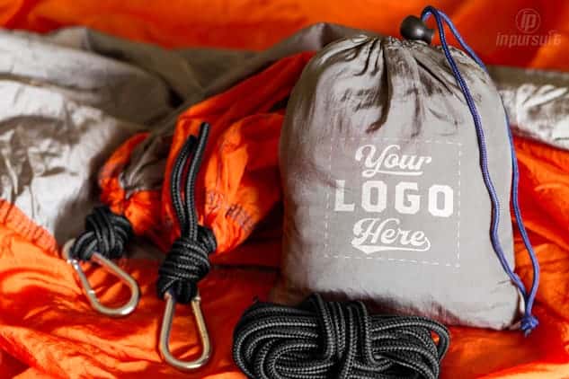 Product image of silver and orange custom hammocks with logo on pouch